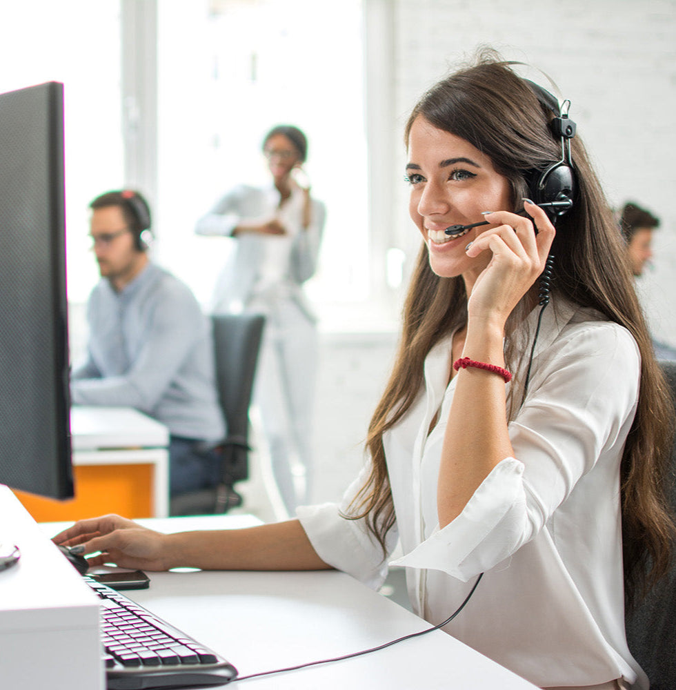Woman selling wholesale textiles with colleages in the background